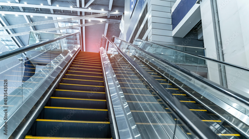 ascending escalator in a public transport area ascending escalator in a public transport area