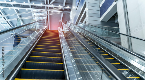 ascending escalator in a public transport area