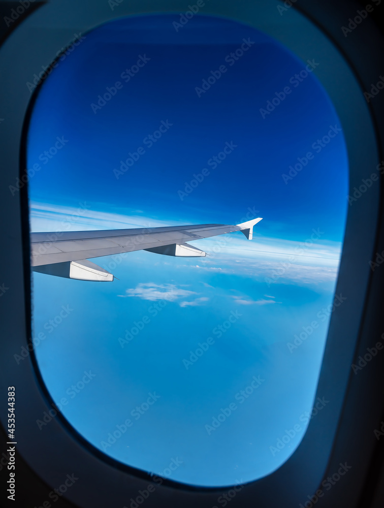 View from an airplane window above the clouds,When sitting next to the engine of the plane will see the beauty of the sky on holiday. View from an airplane window above the clouds,When sitting next to the engine of the plane will see the beauty of the sky on holiday.