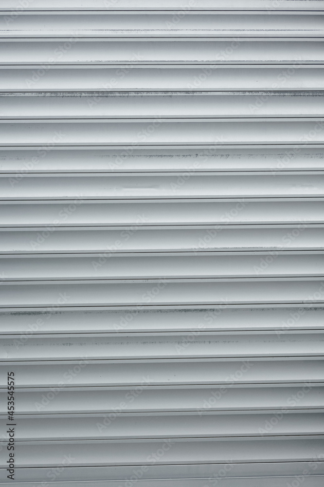 Steel roll doors in front of the store. close up texture