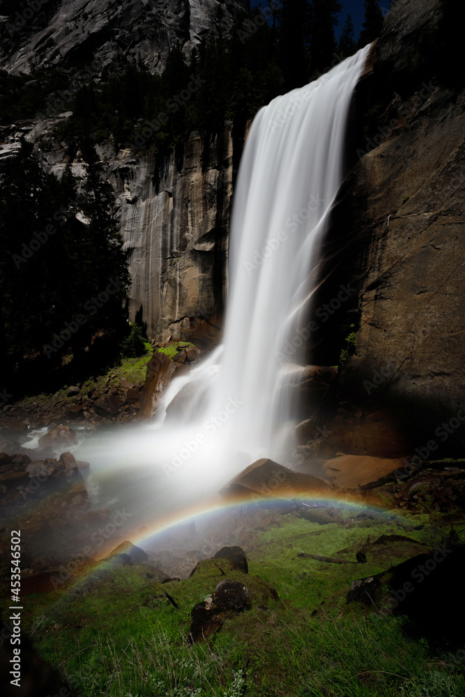 ainbow and Flowing Waterfall Cascading Summer Mountain Rocks in Yosemite National Park California Green Grass and Landscape Colorful Shines Bright Sun Mist Using Long Exposure. Nature and Flowers Pic