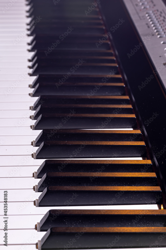 Close-up of an electronic piano keyboard, soft focus. Close-up of an electronic piano keyboard, soft focus.