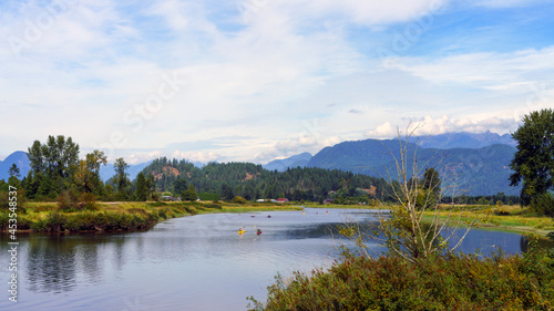Kayakers and paddleboarders enjoying a peaceful outing surrounded by spectacular scenery and mountains