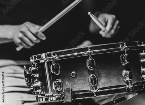 Wall Mural Close-up shot of a drummer playing a snare drum with sticks.