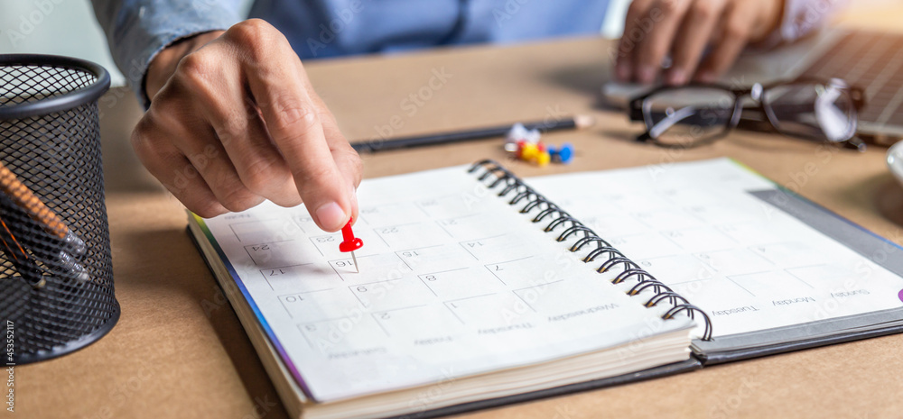 Businessman agenda calendar and reminder agenda work online at home men plan daily appointments and vacation travel journals in a diary at their desk . calendar reminder event concept . Businessman agenda calendar and reminder agenda work online at home men plan daily appointments and vacation travel journals in a diary at their desk . calendar reminder event concept .