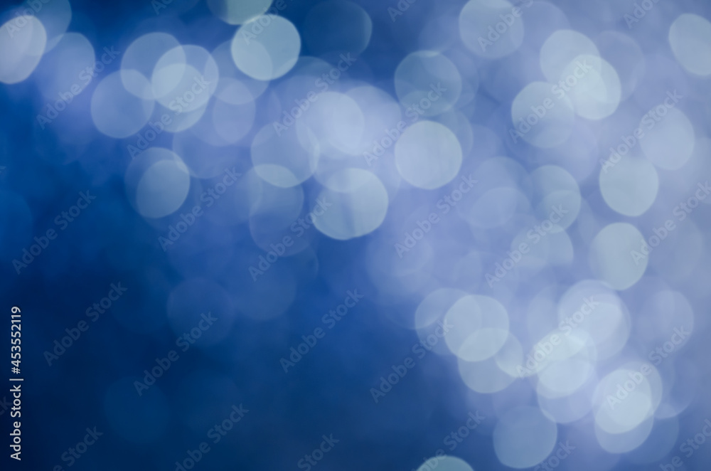 abstract blue bokeh glitter sparkle background.