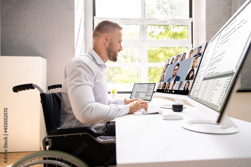 Disabled Professional Worker In Wheelchair Working Disabled Professional Worker In Wheelchair Working