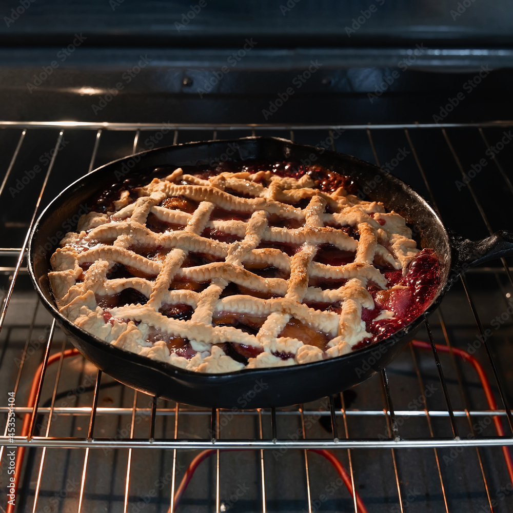 Homemade plum tart in the oven.