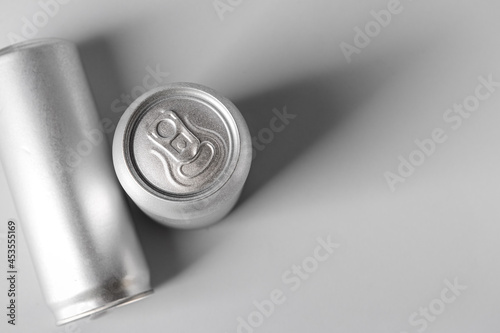 Cans of soda on grey backgr...
