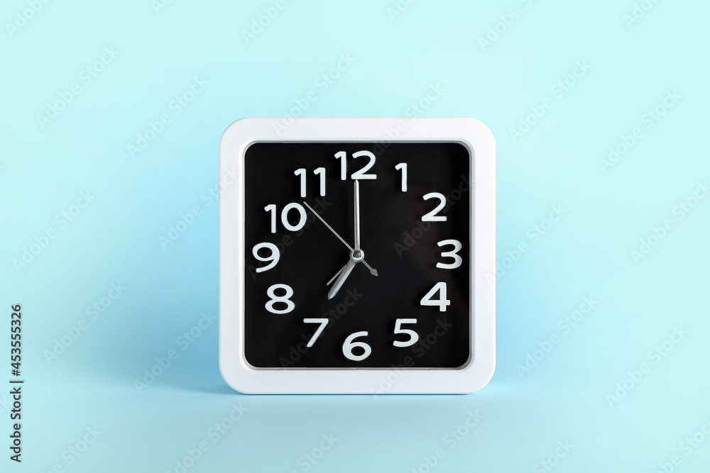 Stylish clock on color background Stylish clock on color background