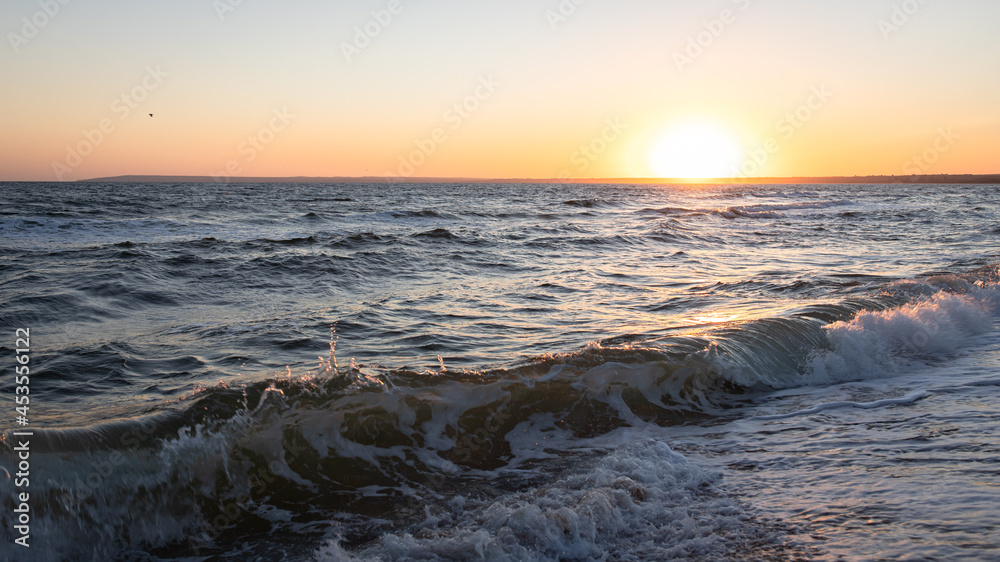 Dawn on the sea coast and storm