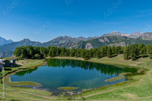 Panoramic view of the Lake of Lod, Chamois, Valtournenche, Aosta valley, Italy, in the summer season
