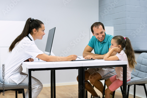 Kid Health Check. Father And Young Child photo