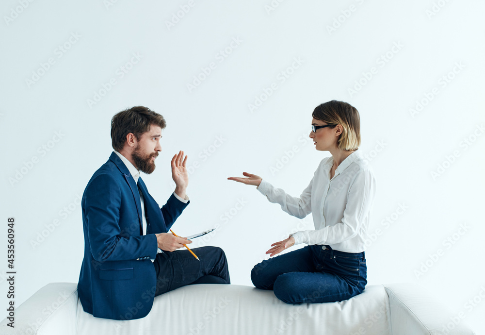 man and woman sitting on the couch communication work professionals team man and woman sitting on the couch communication work professionals team