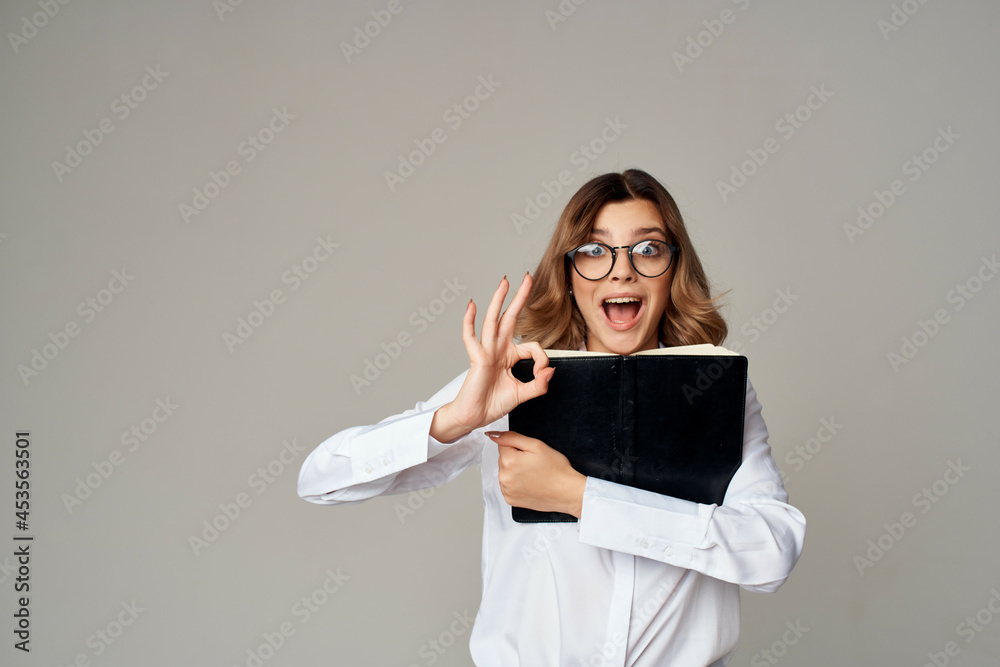 Fototapeta premium cheerful woman in white shirt documents office manager studio