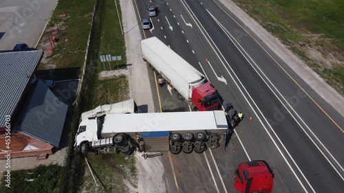 Top view of a car accident involving a truck and a bus. Filming from a drone