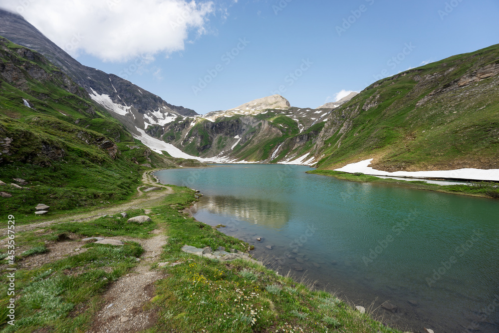 Wonderful alpine lake called Nassfeld Speicher in Hohe Tauern National Park. Austria