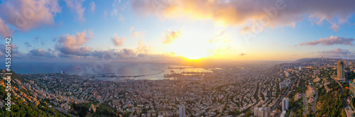 Haifa, Aerial panorama at sunrise, showing the city bay houses and commercial Port.