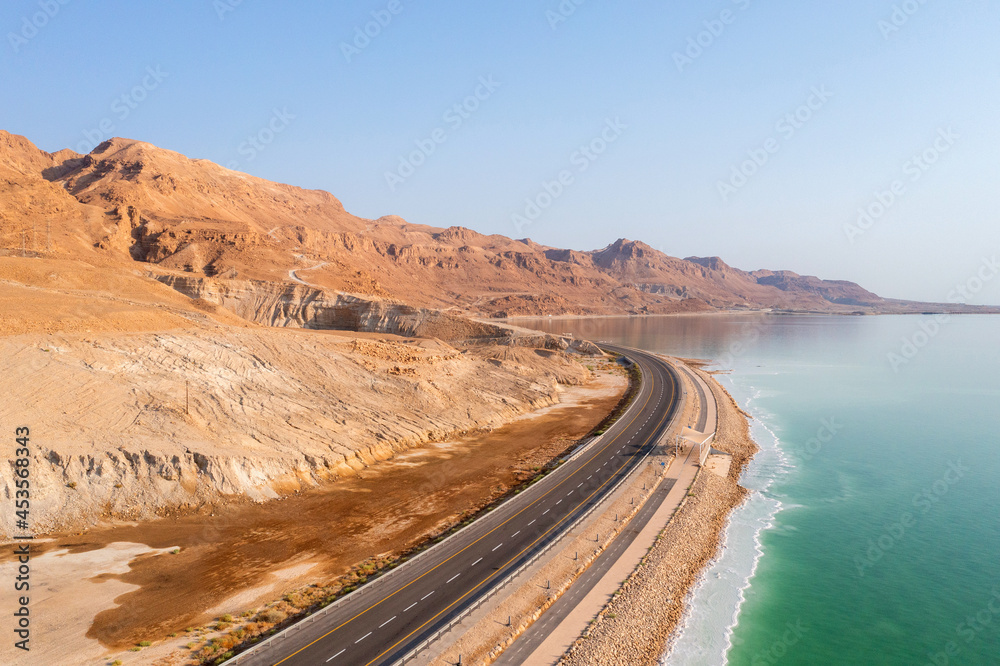 Dead Sea waterfront highway on a beautiful morning, Aerial view.