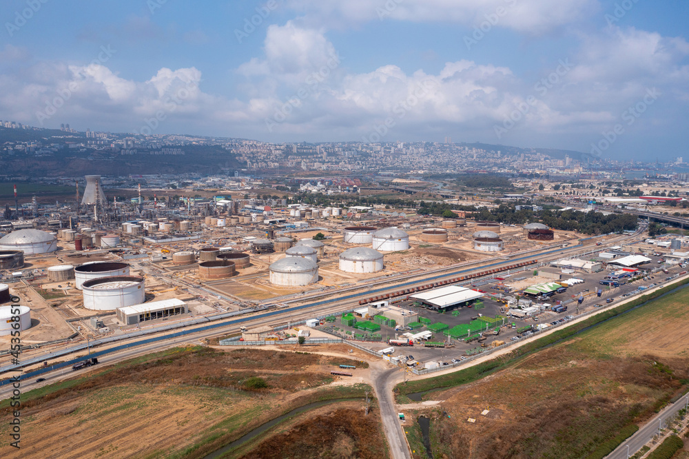 Haifa Oil refinery facilities compound with the city skyline in the background, Aerial view.

