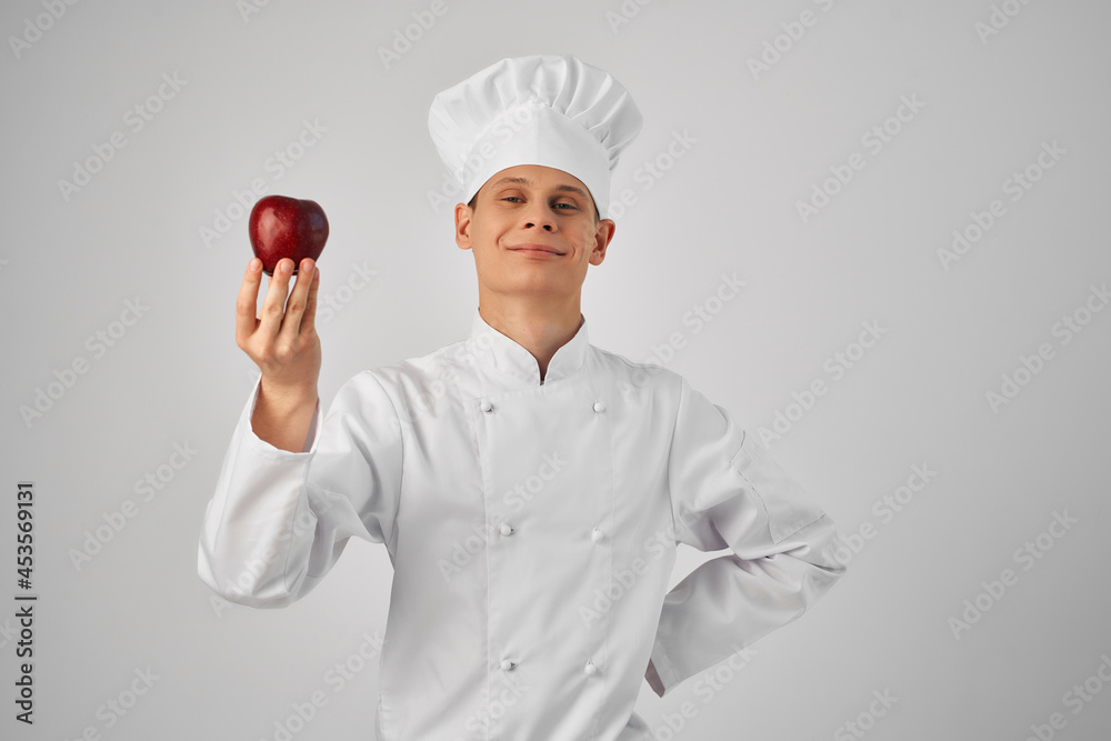 chef with apple in hand fresh food professional kitchen chef with apple in hand fresh food professional kitchen