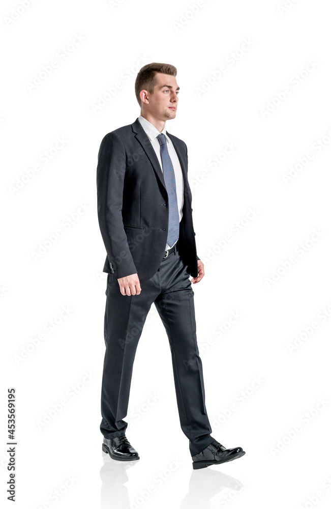 Young ambitious businessman wearing formal suit is walking Young ambitious businessman wearing formal suit is walking