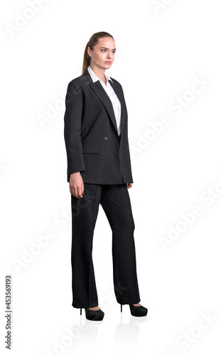 Young attractive businesswoman wearing formal suit is standing