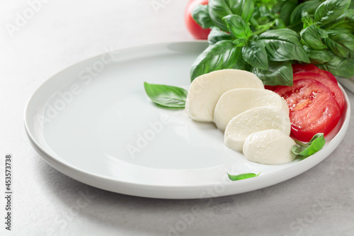 Mozzarella with tomatoes and basil.