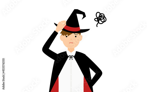 ハロウィンの仮装、魔法使い姿の男の子が頭に手を当てて困っているポーズ