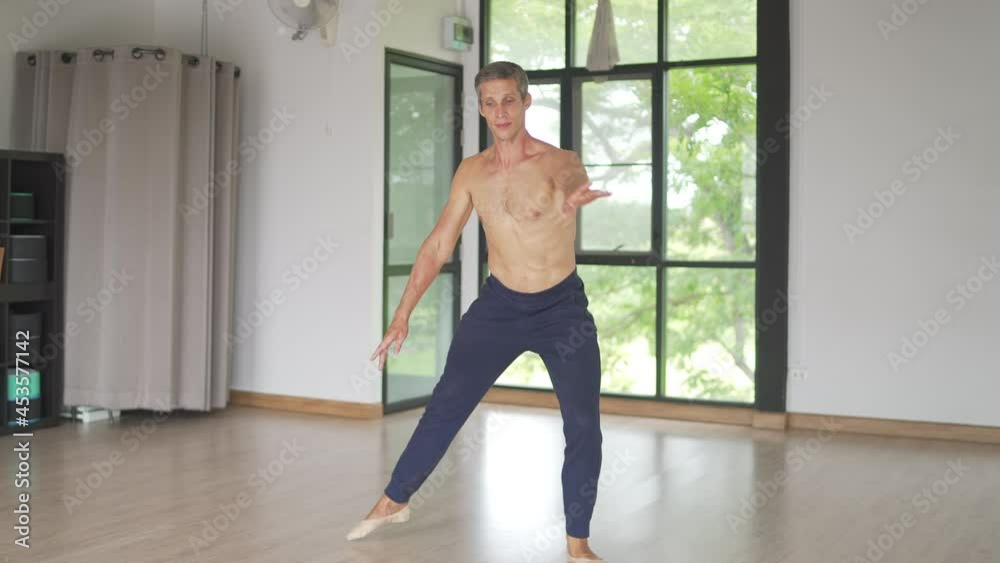 4K Confidence Caucasian male ballet dancer practicing ballet dance alone in studio room. Handsome man athletic dancing classic ballet showing performance body stretching and strength muscle. 4K Confidence Caucasian male ballet dancer practicing ballet dance alone in studio room. Handsome man athletic dancing classic ballet showing performance body stretching and strength muscle.