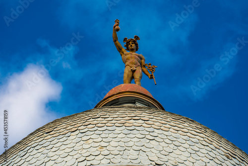 Statue of Mercury on top of the roof of a building in Novi Sad, Serbia photo