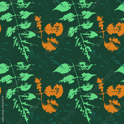 Autumn Pattern Of Leaf Prints . Green Plant Stamps . modern seamless design . Blank for Textiles, Packaging, Printed products, Wallpaper, decoupage cards .leaves and branches of different shapes. 