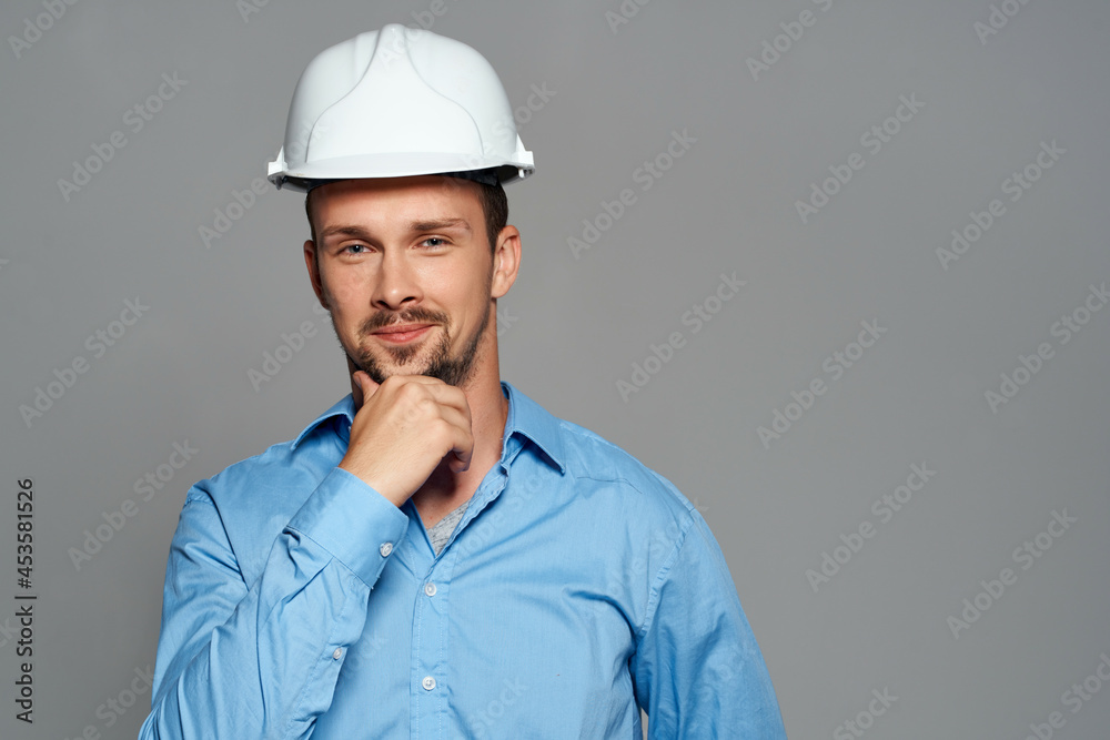 Cheerful male engineer in white construction helmet professional working Cheerful male engineer in white construction helmet professional working