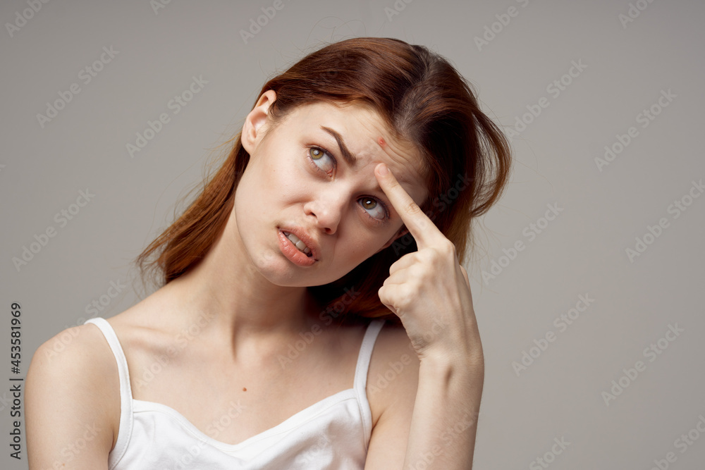 red-haired woman facial skin problems dermatology light background red-haired woman facial skin problems dermatology light background