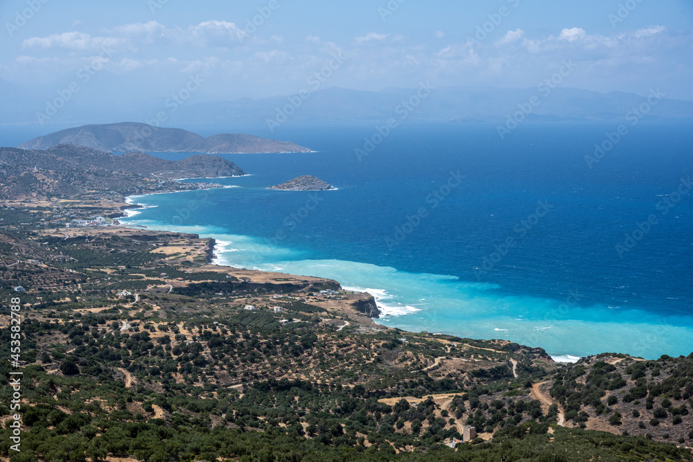 panoramic view from the mountain to the coastal seashore with bays and water of different colors 