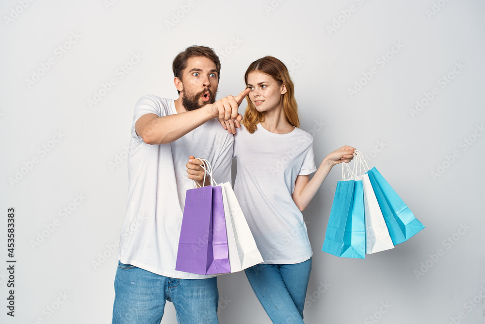 man and woman with packages in their hands discounts Shopping man and woman with packages in their hands discounts Shopping