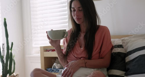 Pregnant woman in third trimester breaths through a braxton hicks contraction