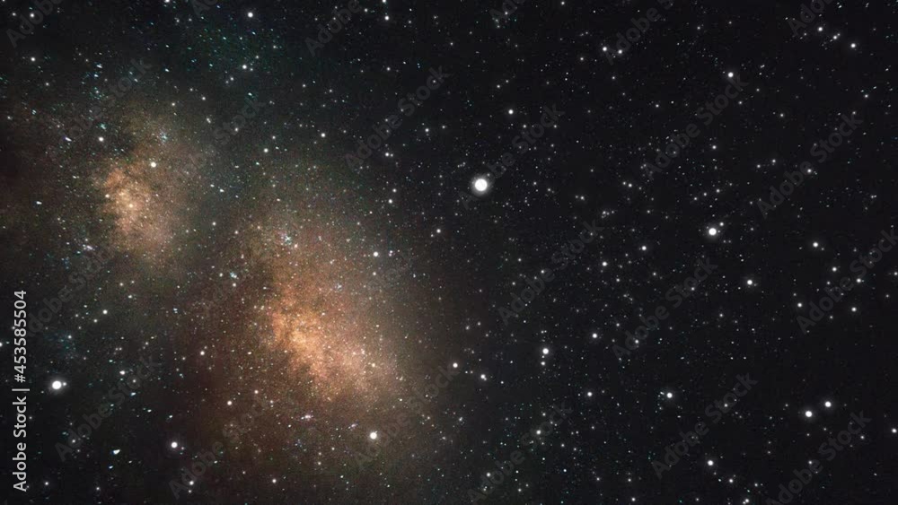 Slow flight to a distant glowing galaxy through many stars and constellations. Billions of stars in the Milky Way galaxy. Seamless, looped, animation. High quality 4k footage