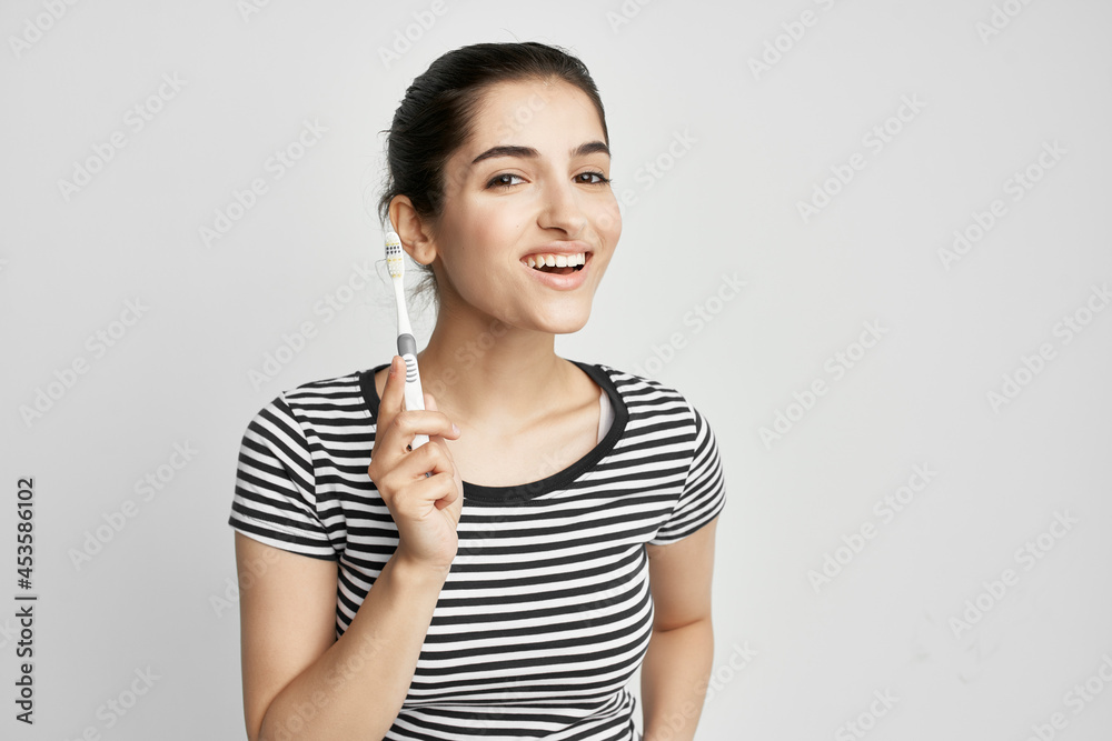 cheerful woman brushing teeth hygiene light background cheerful woman brushing teeth hygiene light background