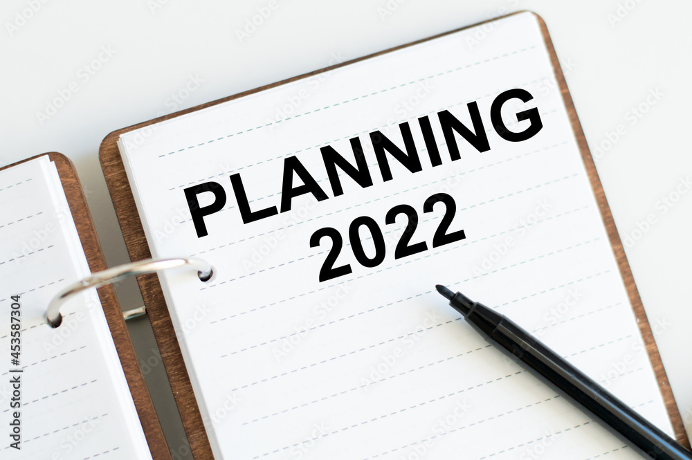 Planning 2022- text written on notepad on white background. Business motivation, inspection concepts ideas. 2022 New Year. Planning 2022- text written on notepad on white background. Business motivation, inspection concepts ideas. 2022 New Year.