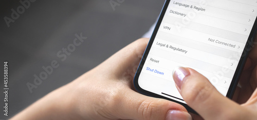 Woman turn off the mobile phone, setting screen close-up, banner design photo