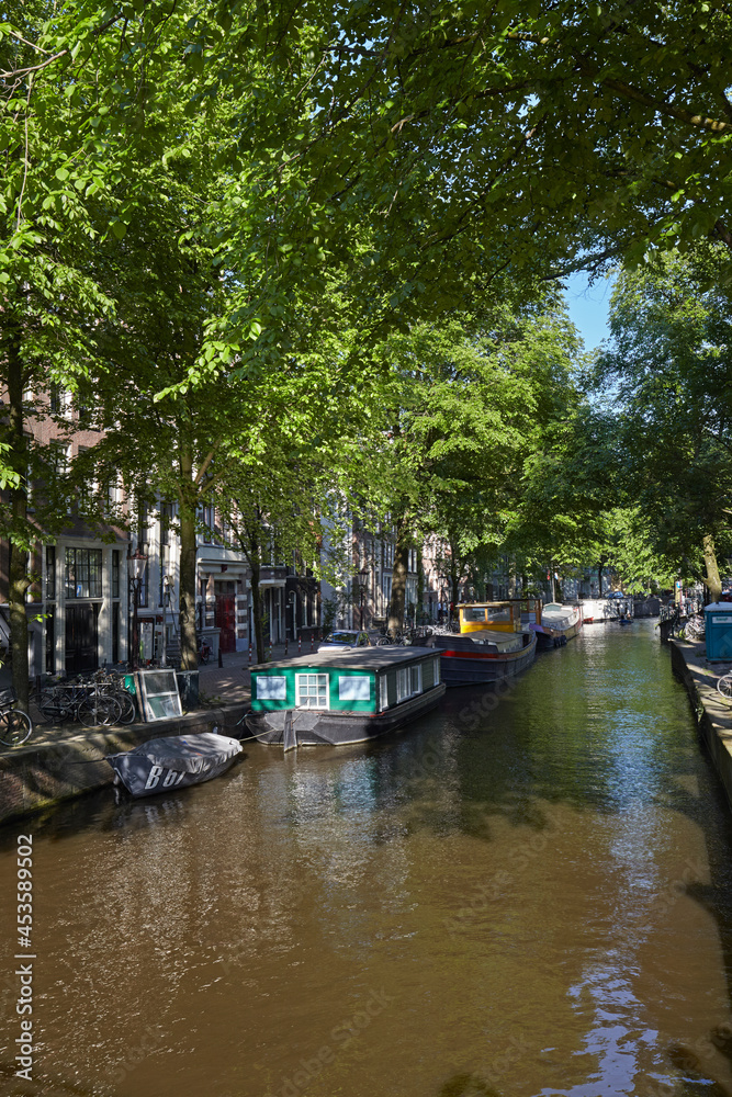 Houseboats in a canal of Amsterdam, Netherlands