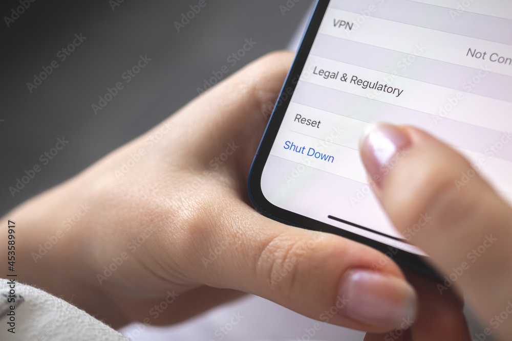 Person shut down the smartphone, mobile phone turn off concept photo, close-up Person shut down the smartphone, mobile phone turn off concept photo, close-up