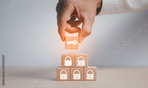 Quadro em tela Business planning ideas and keys unlocking ,man hold wood cubes on table with icon Action plan, Goal and target, success and business target concept, project management, company strategy development