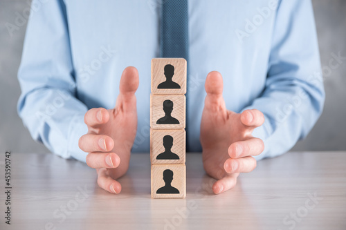 Wallpaper Mural Businessman hold and put wooden cube block shape with user icon on grey table. Space for text. Internet icons interface foreground. global network media concept,contact on virtual screens ,copy space Torontodigital.ca