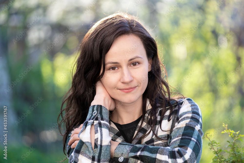 Portrait of pretty young woman relaxing outdoors on warm spring sunny day. Portrait of pretty young woman relaxing outdoors on warm spring sunny day.