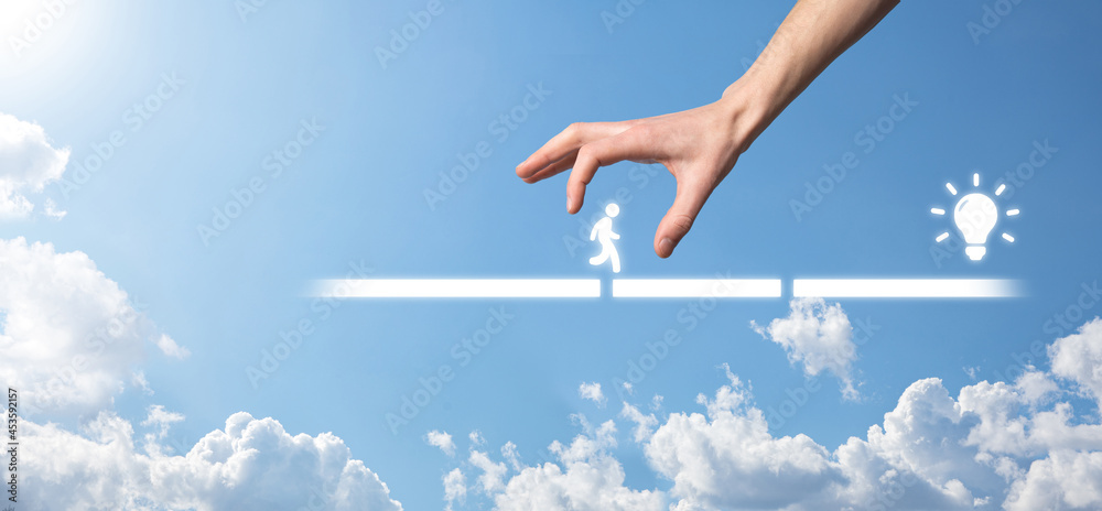 Male business man hand hold a connecting block between two sets of bridge road for a silhouetted man to walk idea icon. Male business man hand hold a connecting block between two sets of bridge road for a silhouetted man to walk idea icon.