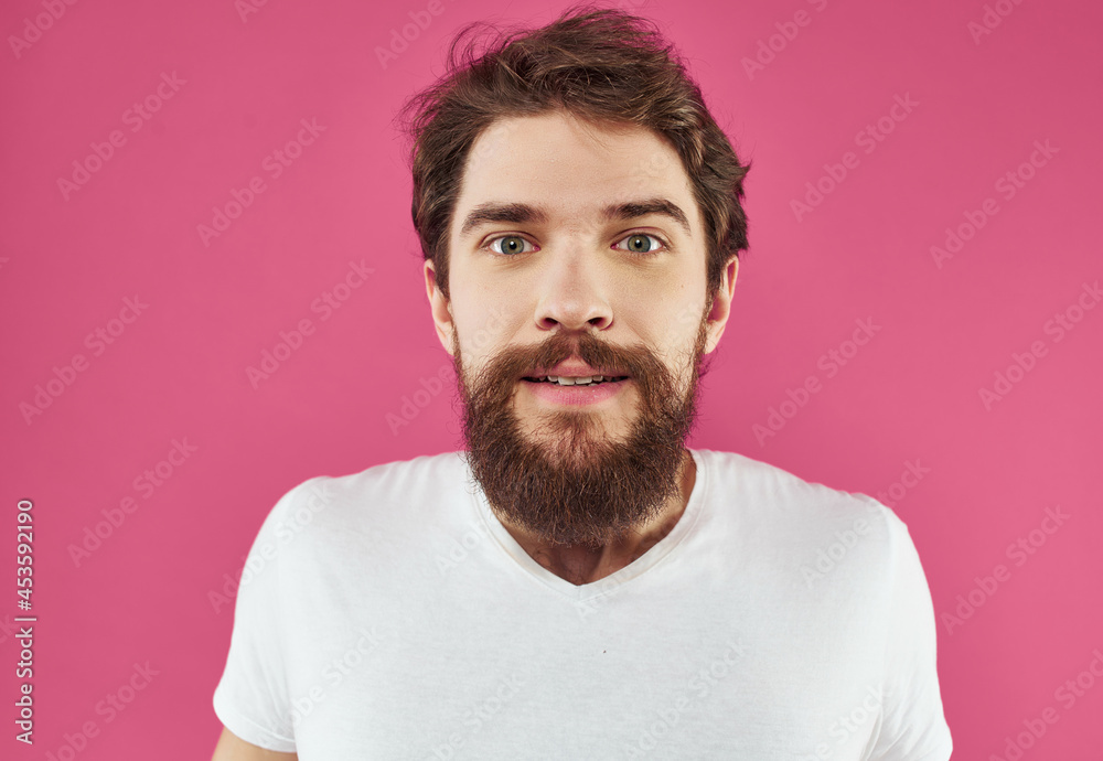 bearded man in a white t-shirt hand gestures Lifestyle bearded man in a white t-shirt hand gestures Lifestyle