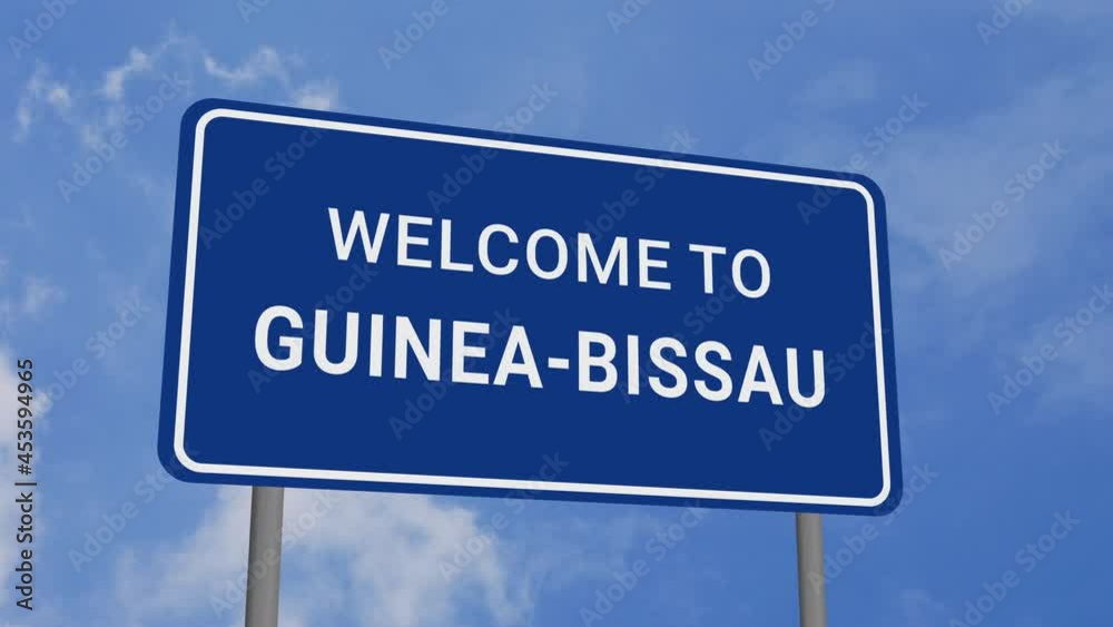 Welcome to Guinea-Bissau Road Sign on Clear Blue Sky with Rapid Moving Clouds Welcome to Guinea-Bissau Road Sign on Clear Blue Sky with Rapid Moving Clouds