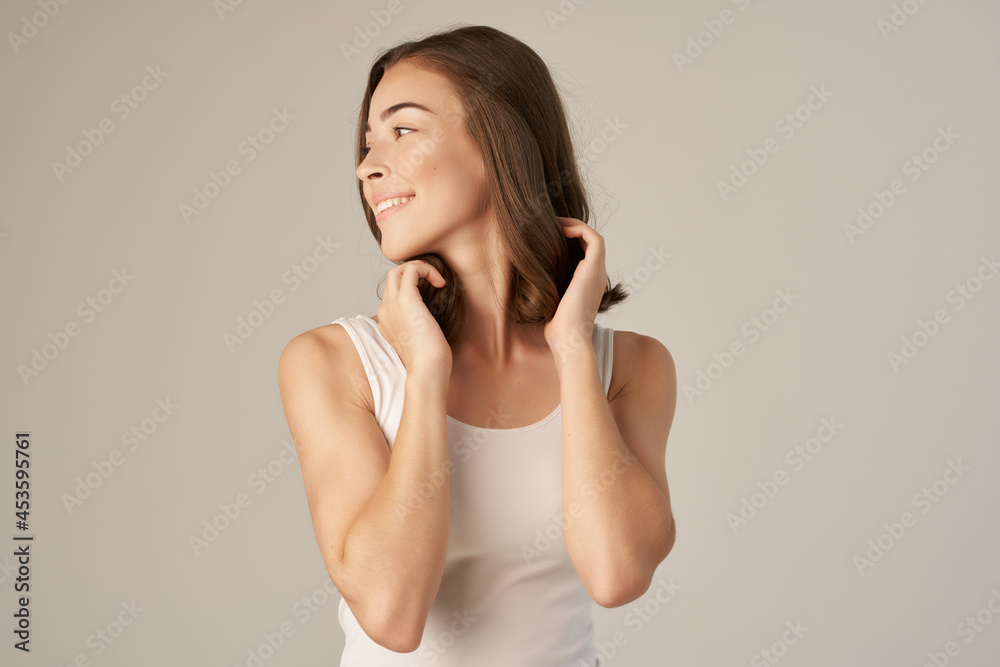 surprised woman in white t-shirt lifestyle emotions beige background surprised woman in white t-shirt lifestyle emotions beige background